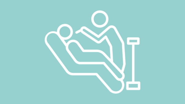 Line drawing of a person lying in a hospital bed with an IV stand beside the bed.